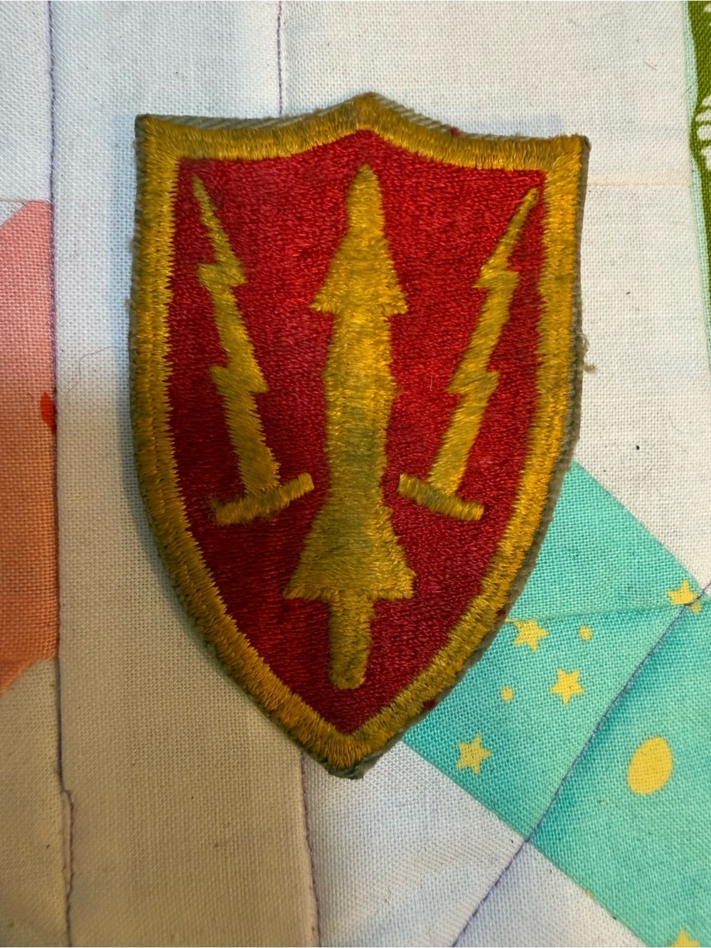 Red and Gold Shield Patch with Lightning and Arrow Motif